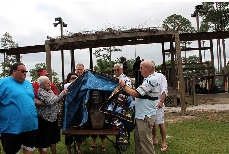 Members of Chief Calvin McGhee's family unveiling his official bust at 2013 memorial. http://www.poarchcreekindians.org/
